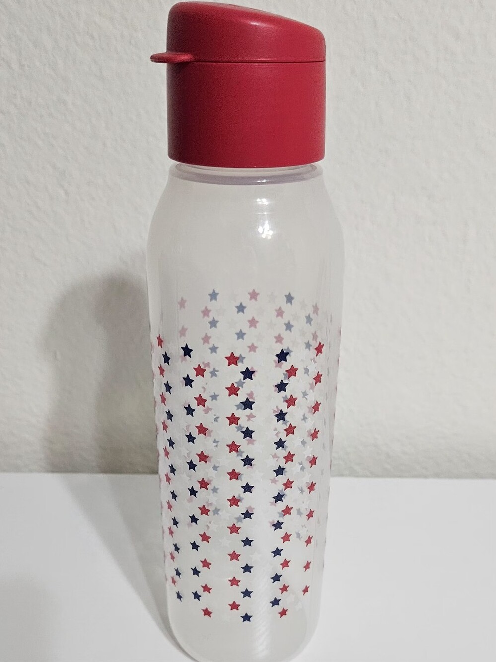 Tupperware Red Bottle with Red and Blue Star Pattern